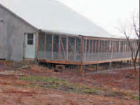 Screened porch with a mesh floor.