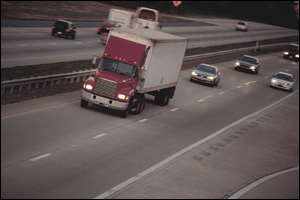 Photo: Large truck and cars on highway