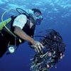 a diver cleans up marine debris