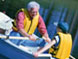 image of two people in a boat wearing life jackets
