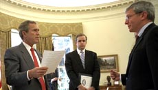 President George W. Bush meets with Dan Bartlett, center, and Josh Bolten in the Oval Office Jan. 9, 2003.  White House photo by Eric Draper.