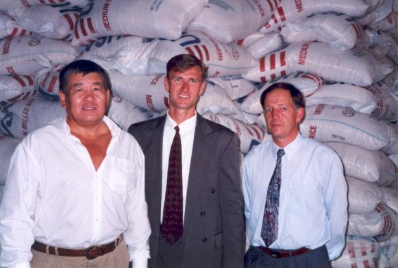 Men in front of bagged food