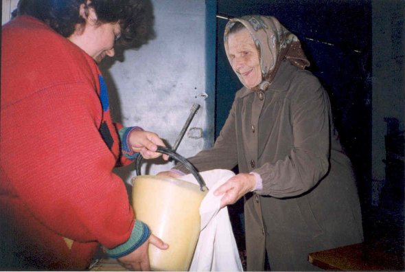 Smiling women receiving food