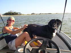 Sandy and dog on boat