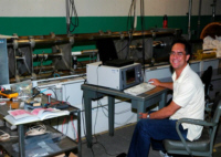 Researcher conducting experiment in the Dynamic Materials Testing Laboratory