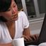 Girl Working At Laptop With Pencil