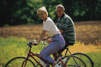 Image of a man and a woman riding bikes