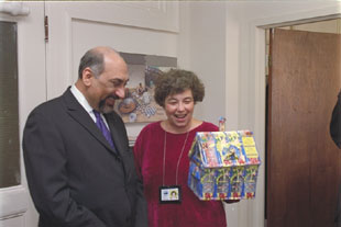 Mary Chambliss and Iqbal Noor Ali admire the sculpture created by 4th grade student Ramzi Gadomamadov of Roshtkala District School to express his gratitude for the milk he and his Tajik classmates receive each school day. 