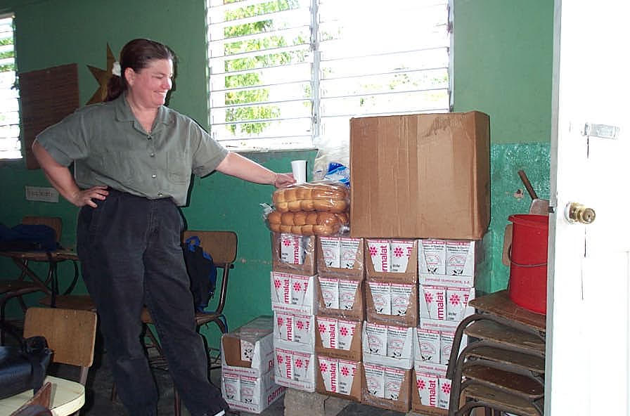 PVO representative with stored donated food