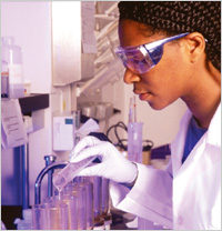 Photo of scientist mixing chemicals