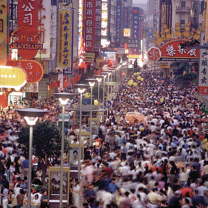 a busy market street crowded with people