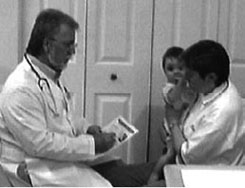 Doctor discussing anitbiotic use with a mother and her child. 