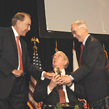 l. to r., Sen. Dole, VA Dep. Secretary Mansfield, Dep. Secretary of Defense England, holding Robert Dole National Award for Service