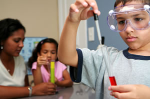 Students with googles and test tubes
