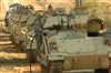 A U.S. Army soldier fuels a Bradley Fighting Vehicle.