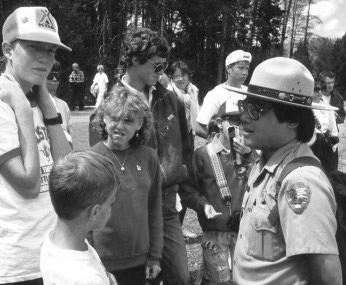 An NPS Ranger answers questions from American and international visitors.