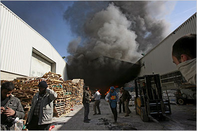 Workers at a United Nations building in Gaza City, which was among those hit during Israeli shelling on Thursday.