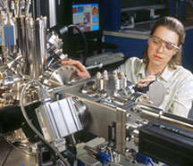 To continue to advance microchip technologies, scientists are studying ways to assemble individual molecules for use as active circuit components. Here a NIST researcher uses a scanning tunneling microscope to study the structure and electrical behavior of such molecules on gold surfaces.