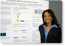 A presenter standing in front of her poster [Photograph by Michael J. Colella, colellaphoto.com]