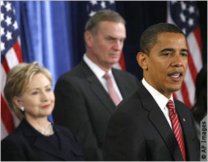 Hillary Clinton, James Jones, Barack Obama on stage (AP Images)