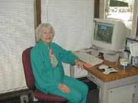 Photo of Min Raibman sitting at a computer