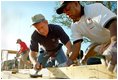 President George W. Bush works on a Habitat For Humanity house in Tampa, Fl., Tuesday, June 5, 2002. 