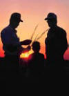 Silhouette of farmers at sunset