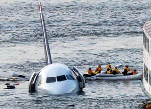 Passengers in an inflatable raft move away from an Airbus 320 US Airways aircraft that has gone down in the Hudson River in New York, Thursday Jan. 15, 2009.