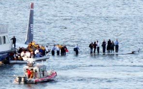 Passengers evacuate US Airways Flight 1549 after the Airbus 320 crashed into the Hudson River.