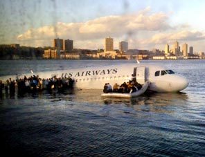 In this photo taken by a passenger on a ferry, airline passengers egress a US Airways Airbus 320 jetliner that safely ditched in the frigid waters of the Hudson River in New York, Thursday Jan. 15, 2009 after a flock of birds knocked out both its engines. All 155 people on board survived. 