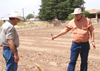 Rick Holdridge explains subsurface drip irrigation to Dennis Alexander, NRCS State Conservationist