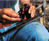 Picture of rancher providing hands-on demostrations of soil sampling