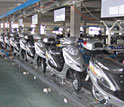 Photo shows e-bikes on a Chinese assembly line.