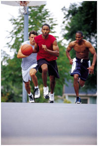 Three men playing basketball