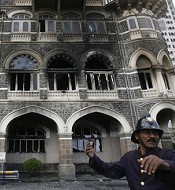 A fireman gestures outside Taj Mahal hotel in Mumbai, 29 Nov 2008