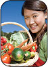 Image of a girls with a basket full of vegetables