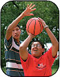 Image of teens playing basketball