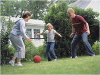 Family playing kickball