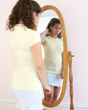 girl looking in the mirror