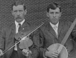 Josh and Henry Reed, ca. 1903. Henry Reed, age 19, plays banjo and his older brother Josh plays fiddle.