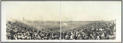 Crowds of spectators seated in an outdoor arena for a show.