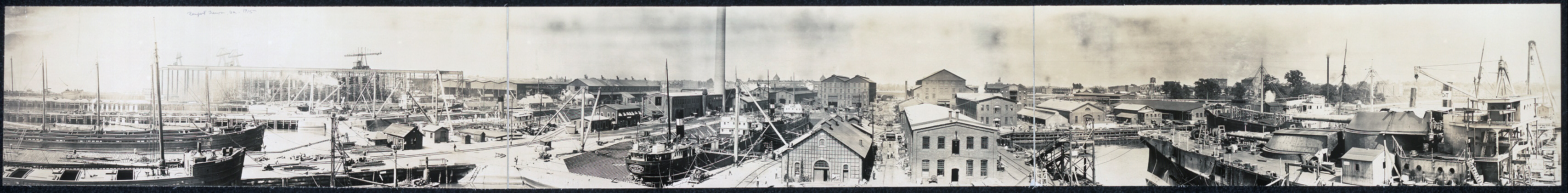 A black and white panoramic view of ships and buildings along the coast in Newport News, Virginia.  