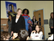 Secretary Spellings, singer Melinda Doolittle, and Harlem Globetrotter Eugene “Wildcat” Edgerson greet students in a class at Midtown West School.
