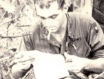 Image of a soldier reading a letter
