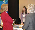 Photo of Kathy Olsen (left) speaking with Allison Byrd and Susan Cook of Consortium for Ocean Leadership