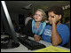 Secretary Spellings trains on a flight simulator at the STARBASE program at Wright-Patterson Air Force Base.