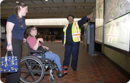 Photograph of a wheelchair user in the Metrorail system
		