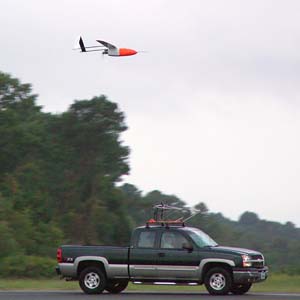 NOAA image of the Aerosonde unmanned aerial vehicle being released from its transport vehicle on the runway at the NASA Wallops flight Facility, in Wallops Island, Va., to fly into and take measurements of Tropical Storm Ophelia on Sept. 16, 2005. 