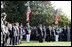 Honoring the memory of those who died during terrorist attacks on this day two years ago, President George W. Bush, Laura Bush, Vice President Dick Cheney and Lynne Cheney stand with White House staff for a moment of silence on the South Lawn 8:46 a.m., Thursday, Sept. 11, 2003.