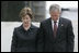 President George W. Bush and Laura Bush stand in silence after laying a wreath in the north reflecting pool at Ground Zero September 10, 2006, in commemoration of the fifth anniversary of the terrorist attacks of September 11, 2001, on the World Trade Center in New York City.